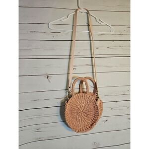 Clare V. Round Straw Woven Crossbody Peach Bag with Leather strap.
